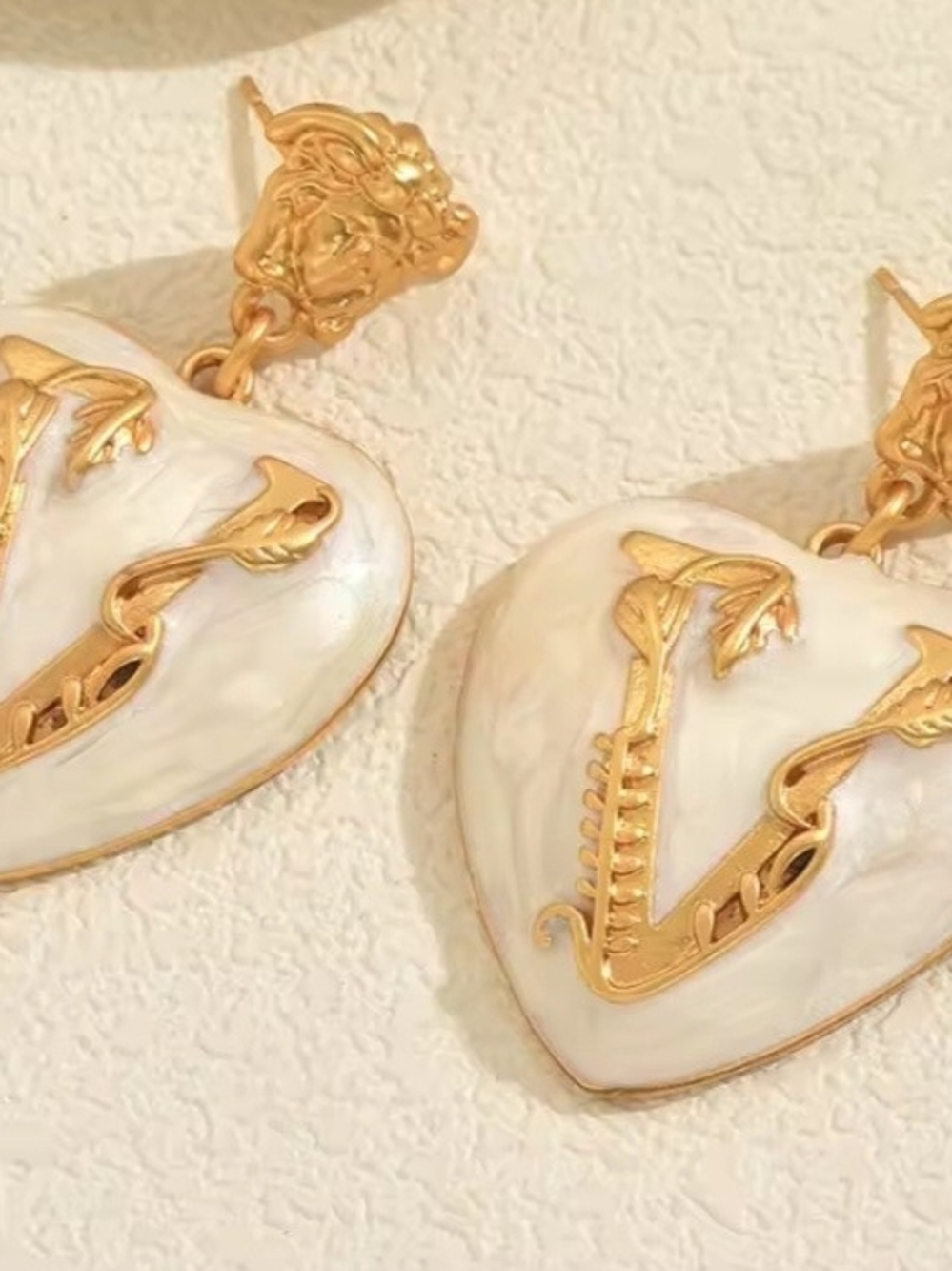 Gold-Tone White Heart Drop Earrings with Decorative V Detail